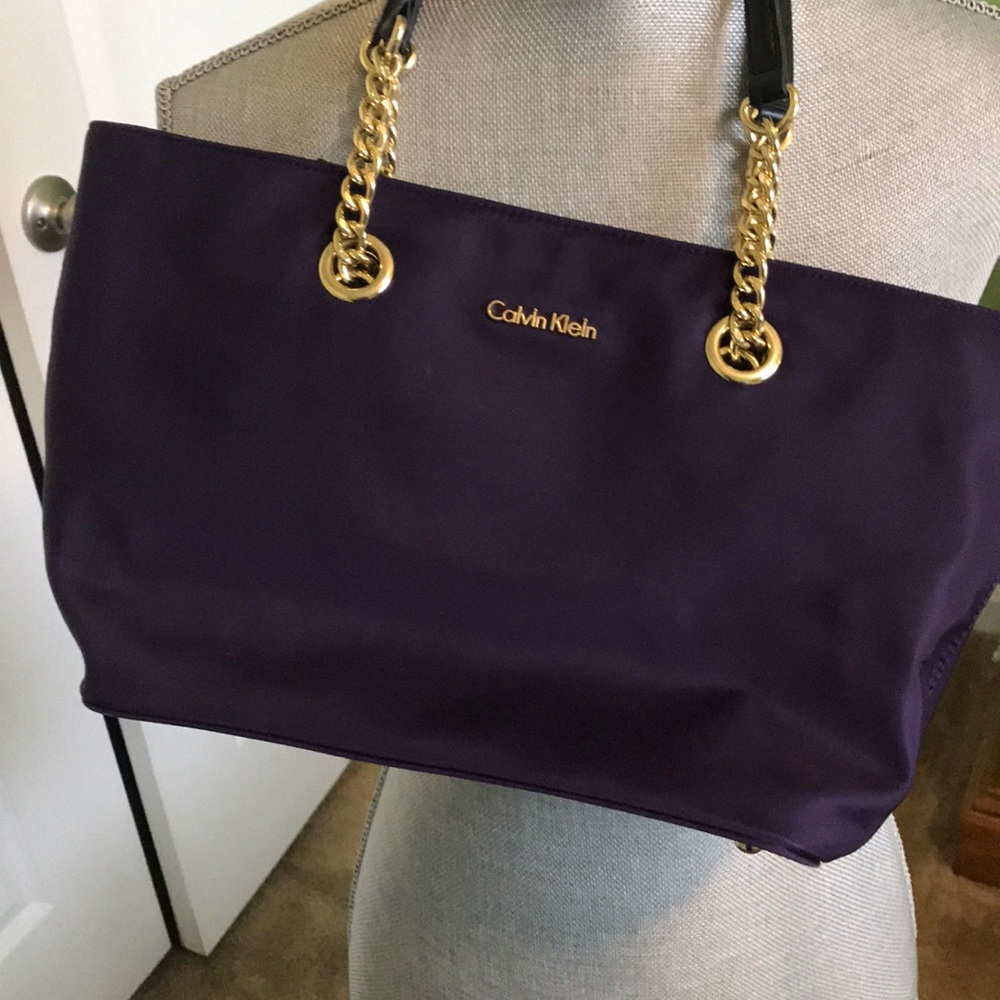 Purple Calvin Klein handbag.
